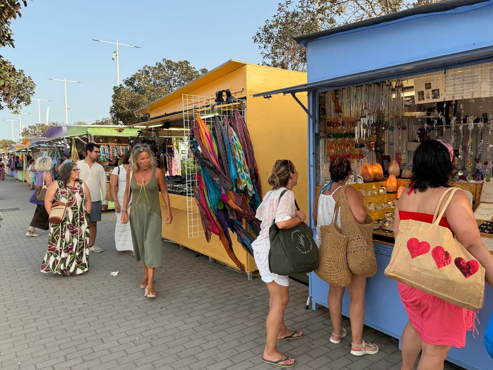 Summer artisan market stalls by the port in Dénia